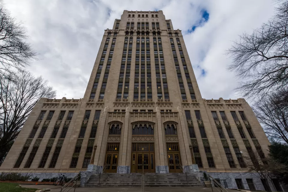 View looking up at high-rise Art Deco Atlanta City Hall building.